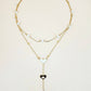 Collana a doppia catena con perle e pendente